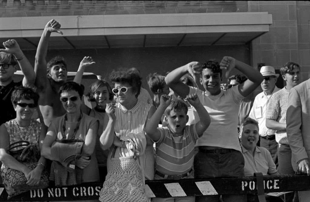 Counter-demonstrators behind a police fence on the Atlantic City Boardwalk, during a Miss America beauty pageant protest, Atlantic City, 1968.