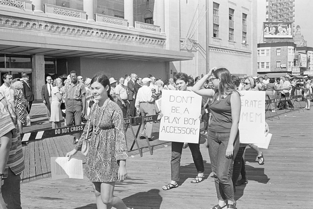 Demonstrators picketing the Miss America Pageant take a break as they await the hour when the new Miss America will be named.