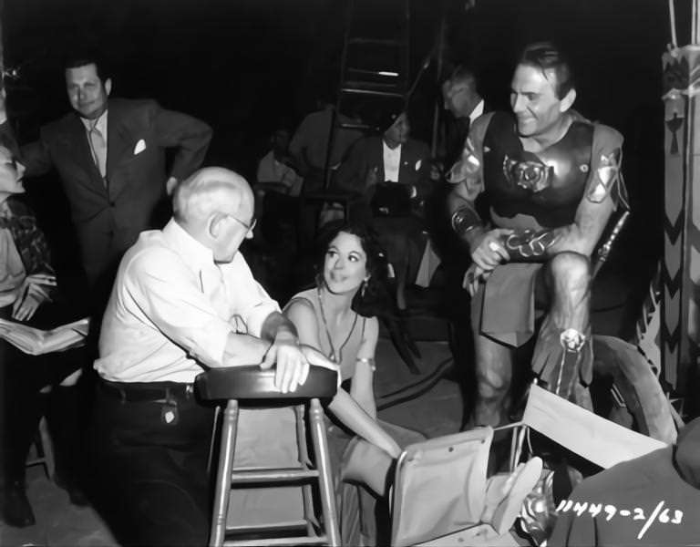 Script Supervisor Claire Behnke, Cecil B DeMille, Hedy Lamarr and Henry Wilcoxon on set candid during filming of 'Samson And Delilah', 1949