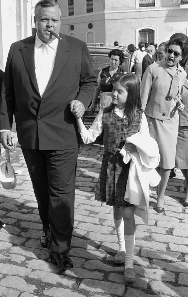 American actor and director Orson Welles in the "Feria de Sevilla" with his daughter Beatrice, Sevilla, Spain, 1966.