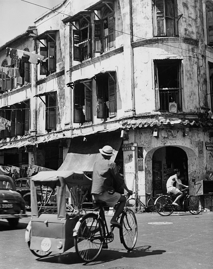 A rickshaw at the corner of Telok Ayer Street and Boon Tat Street, Singapore, November 1960.