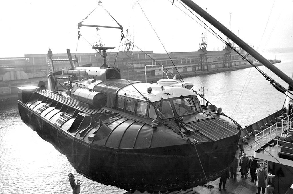 A view as a Army SRN -6 hovercraft is loaded onto the ship bound for Singapore, 1968