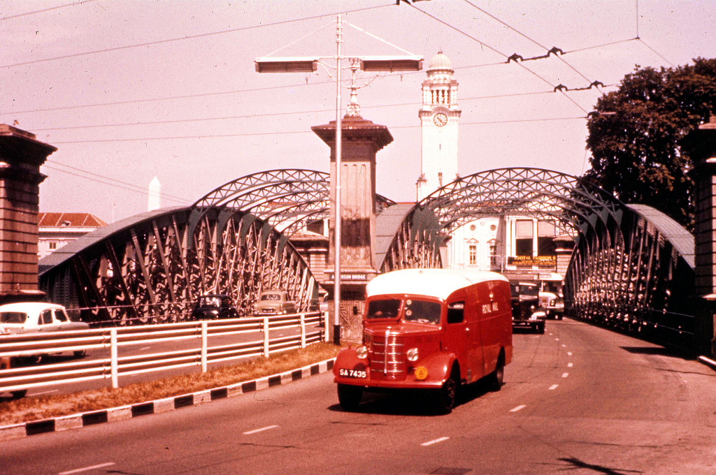 Postal vans cross a bridge in central Singapore in 1960.