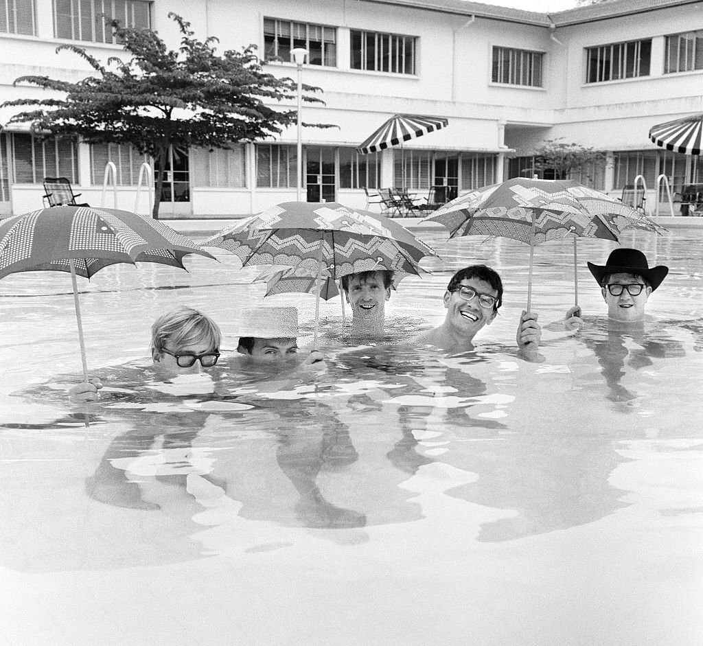 A Malaysian Policeman Holding An Indonesian Prisoner caught in a Little Island to the East of Singapore On January 4, 1965.