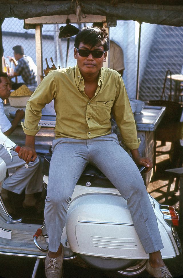 The proud owner of his motor scooter at the roadside in Sembawang, 1960s