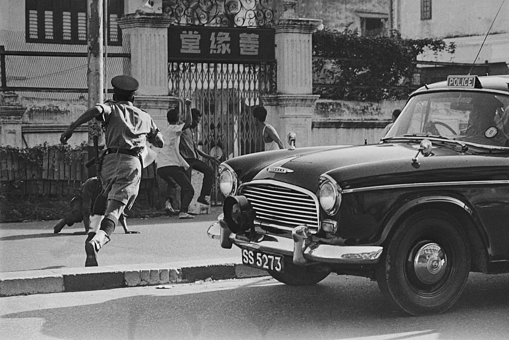 Police Trying to Control Street Riot in Singapore, 1966