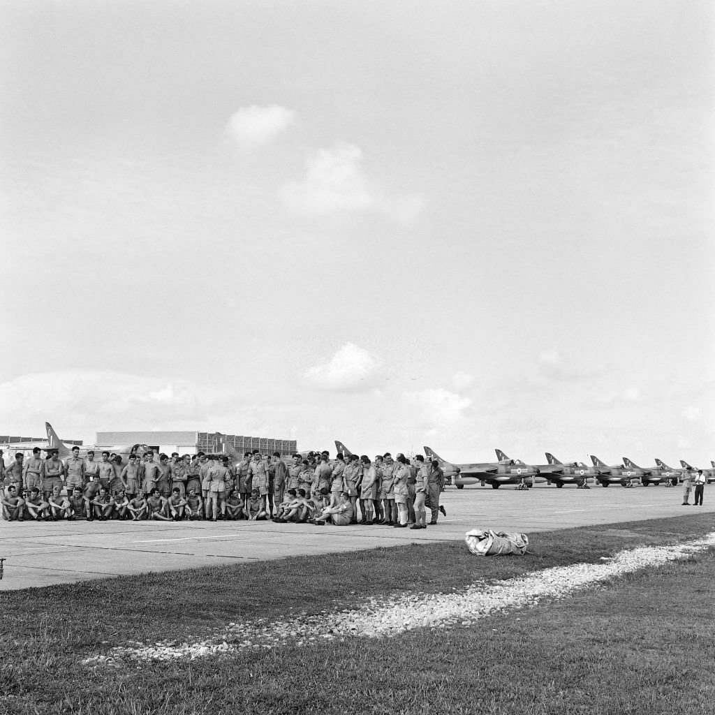 Troops of the NR20 squadron of the Royal Air Force are stationed at Tengah airfield, Singapore, ready to embark, on May 25, 1962, to move towards Thailand.