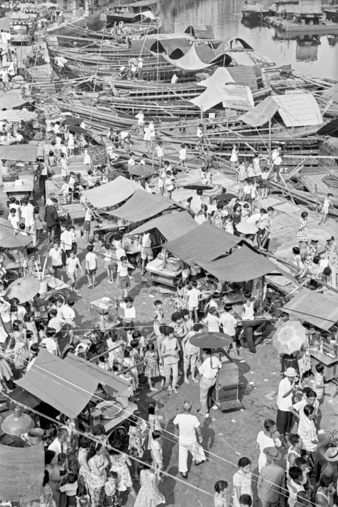 People crowding an outdoor market, Singapore, 1962