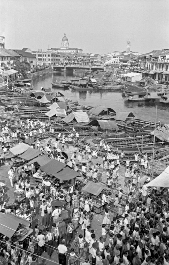 People crowding an outdoor market, Singapore, 1962