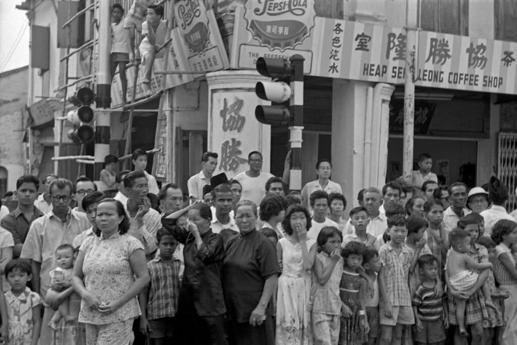 Singapore citizens in a street. Singapore, 1962