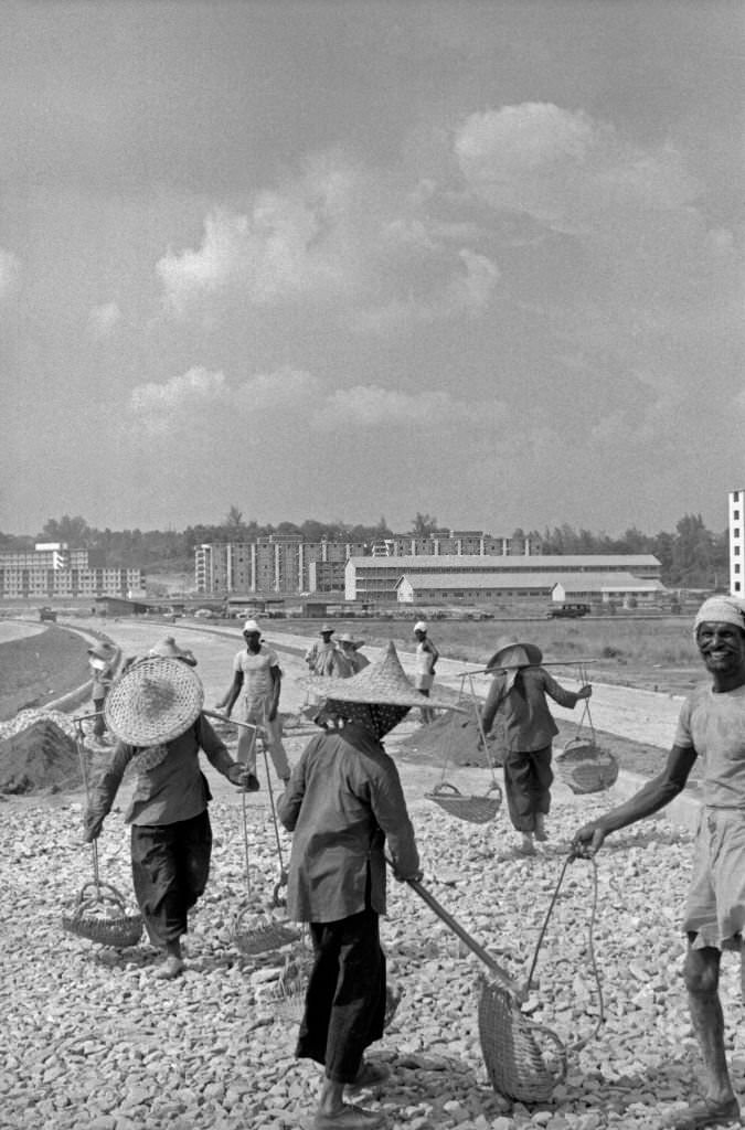 Men and women building a street, Singapore, 1962