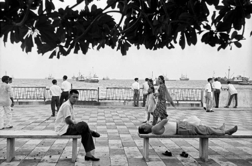 People walking and relaxing on a look-out facing the Indian Ocean, Singapore, 1962