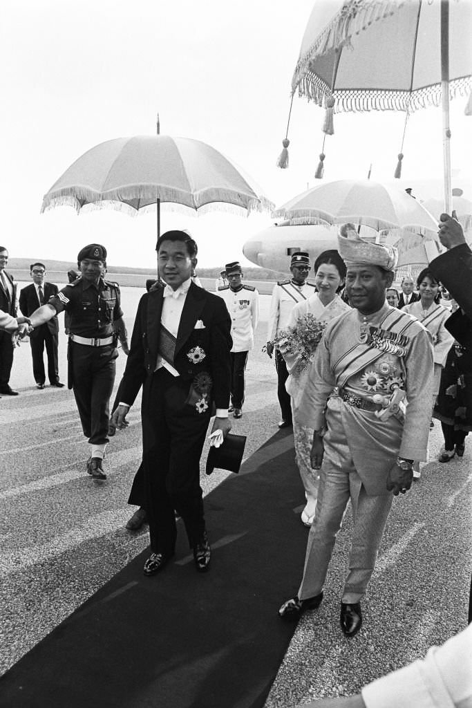 Crown Prince Akihito and Crown Princess Michiko are welcomed by Deputy Yang di-Pertuan Agong Abdul Halim Mu'adzam and his wife Sultanah Bahiyah on arrival at Subang International Airport, 1970