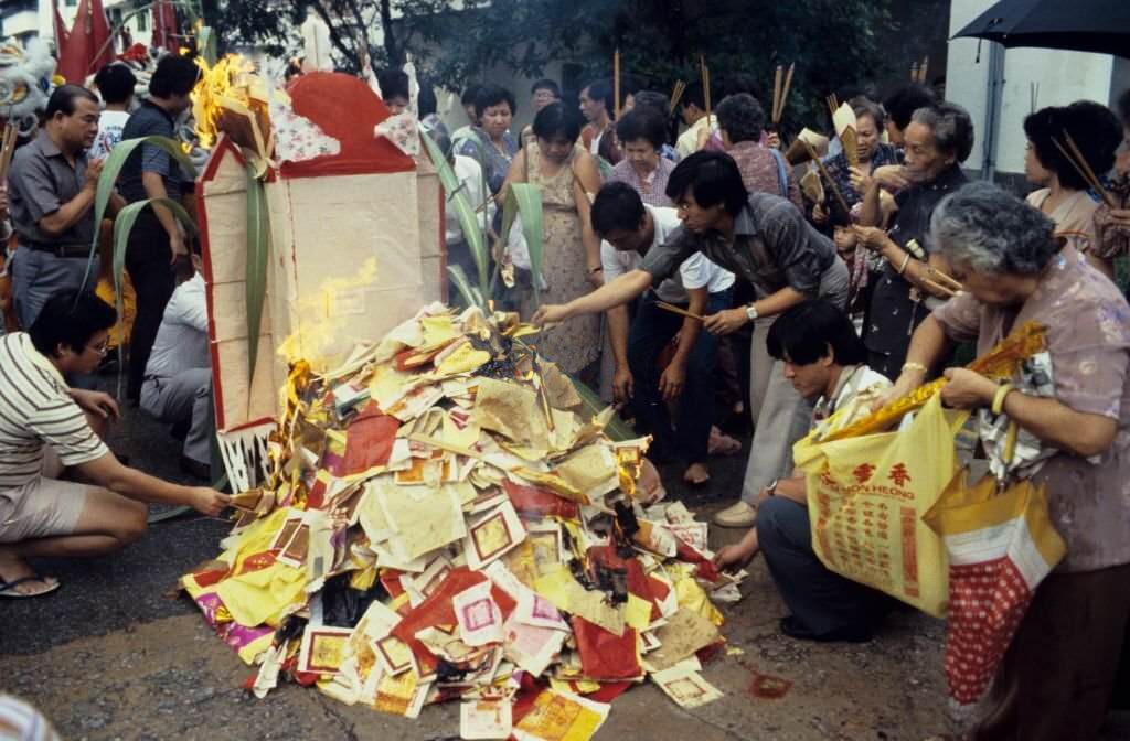 Devotees burning offerings to the Monkey God during his Festival in Chinatown, Singapore, 1985