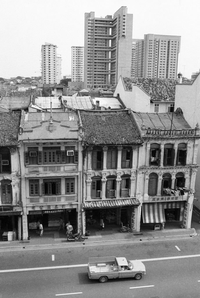 Shophouses on Upper Cross St seen before their residents are relocated in September 1983, and before being restored following conservation status in 1989, Chinatown, Singapore,