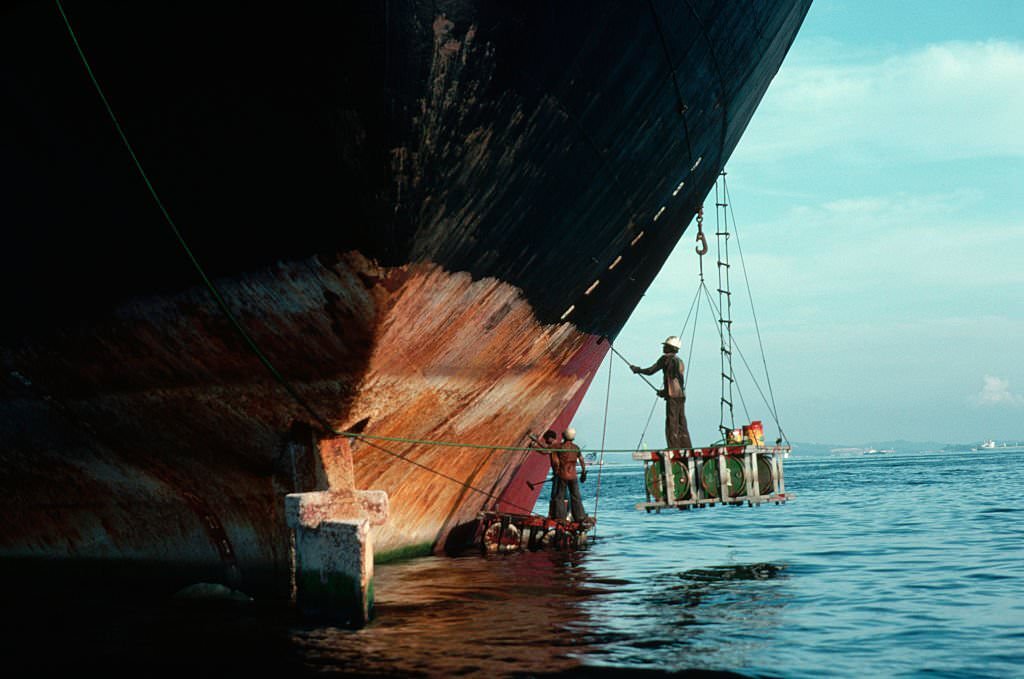 Painting Ship Hull From Scaffolding.