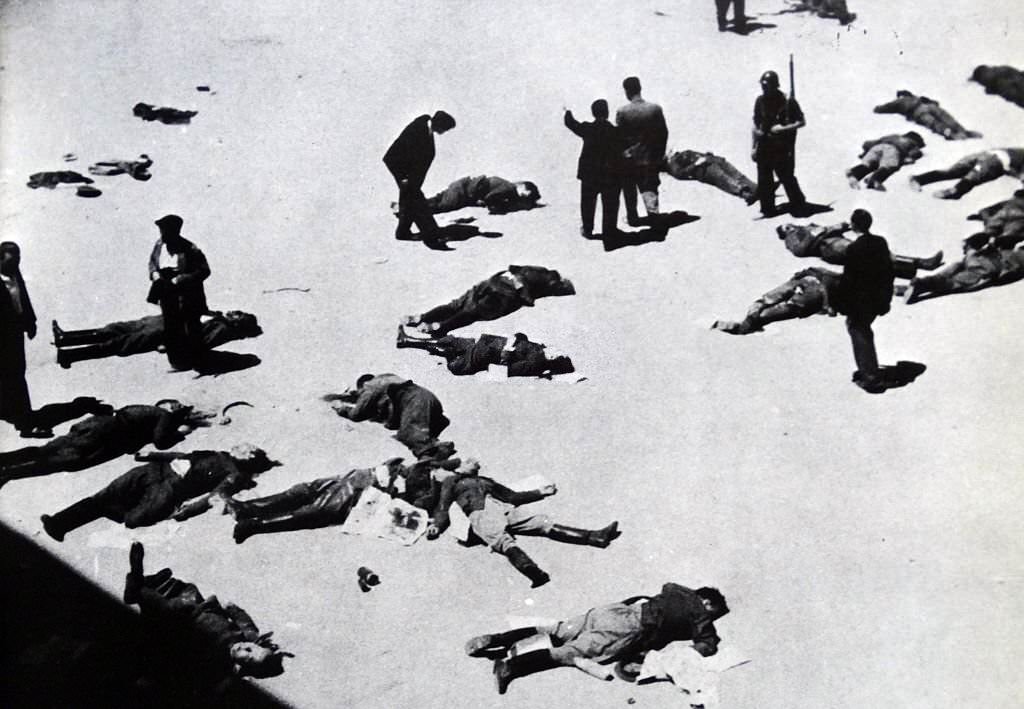 Anti-fascist militias survey their casualties after the capture of the Montaña barracks in Madrid from nationalist forces led by General Joaquín Fanjul, commander of the military garrison. Spanish Civil War July 1936.