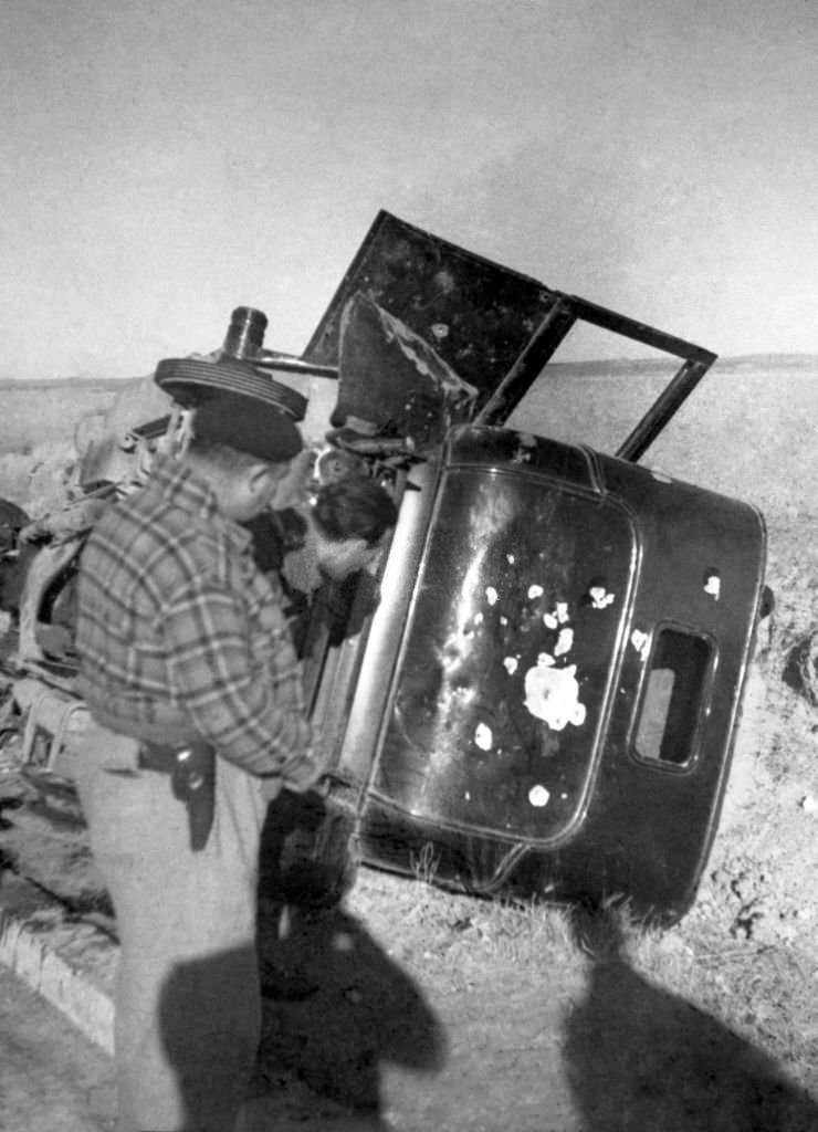 The carcass of a car machine-gunned by a nationalist plane during the war in Spain, in March 1937, in the region of Madrid.