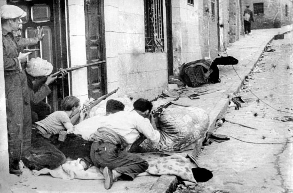 Republicans fighting in a street of an unidentified village, 1936