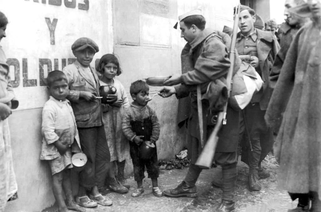 Nationalist Soldiers Giving food provision to Children in Madrid, 1936