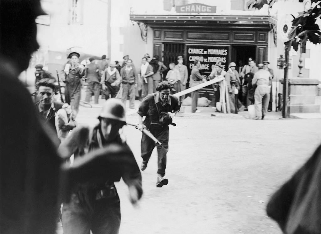 In Irun on the French-Spanish Border in Basque Country, A Militiamen flees the Combat Zone on the Spanish Side of the International Bridge Of Behobie On September 4, 1936