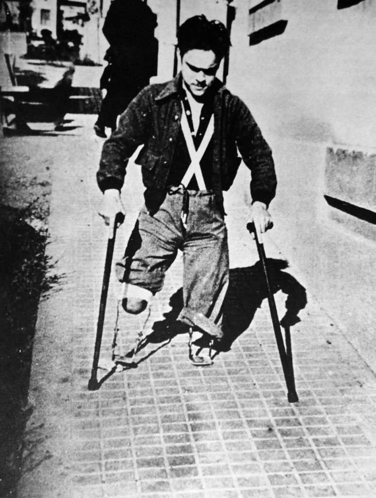 Amputee war veteran, in a Spanish street during the Spanish Civil War.