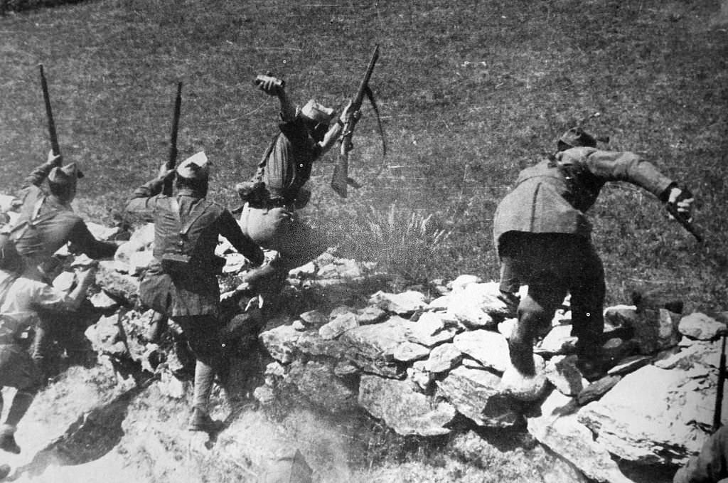 Nationalist soldiers in action during an assault on Madrid, during the Spanish Civil War.