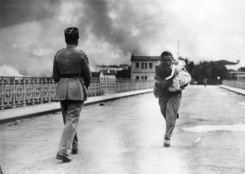 Refugee woman runs towards the Spanish French border, during the Spanish Civil War.