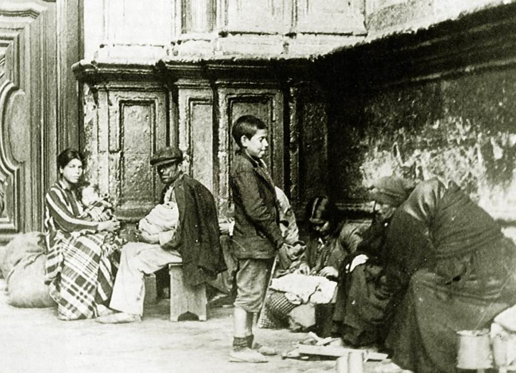 Homeless families living on the streets of Malaga, Spain, during the Spanish Civil War.