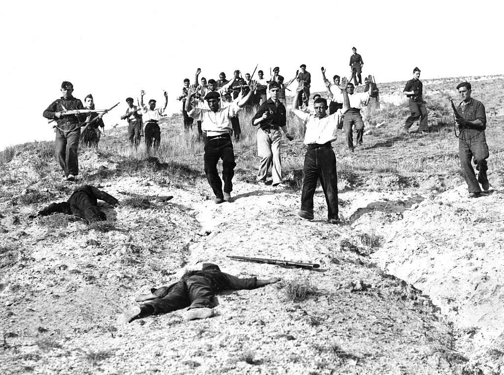 Nationalist troops capture Republican soldiers. In 1936, at the Battle of Somosierra, in the heights of the pass between Carlist and Falangist units and Republican troops.