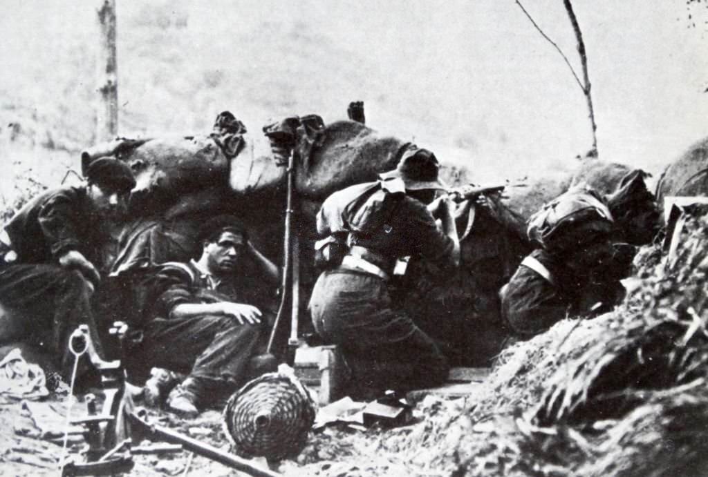 Republican soldiers shelter in a trench during the Campaign of Gipuzkoa, the Spanish Civil War, Nationalist Army conquered the northern province of Gipuzkoa, held by the Republic.