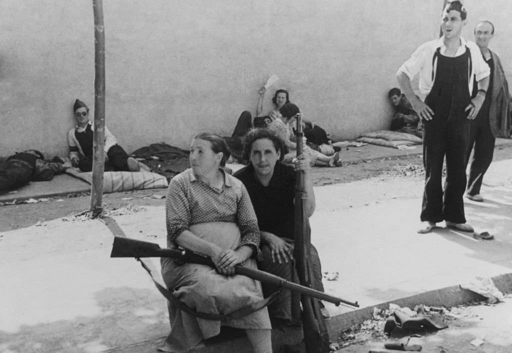 Women with their weapons in the streets of Barcelona during the Spanish Civil War.