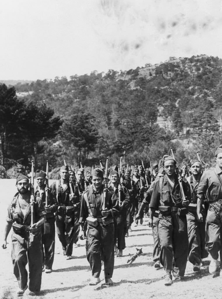 Loyalists marching to the base camp near Santa Maria, north-west of Madrid during the Spanish Civil War.