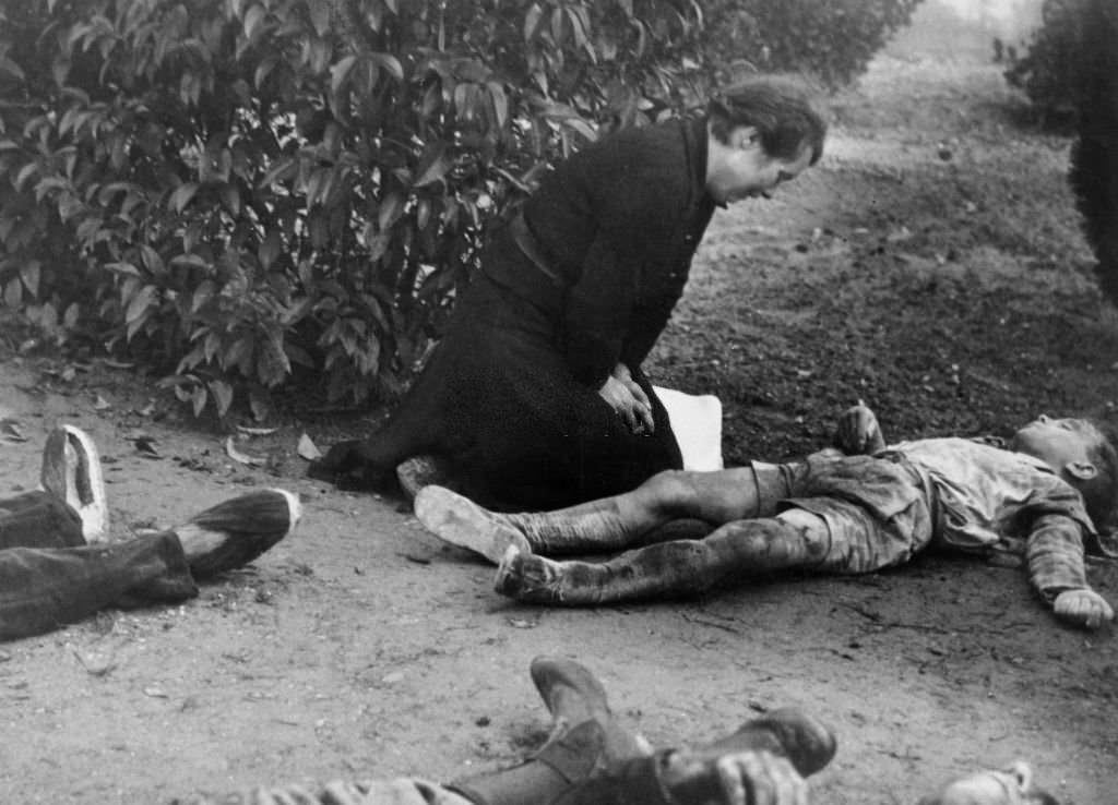 Child victim of bombing in Lerida and his mother, Spain, during the Spanish Civil War