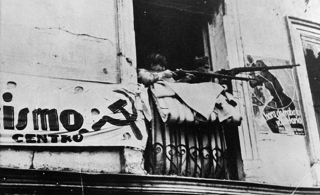 Militia fighters resist the advancing nationalist army in Madrid during the Spanish Civil War.