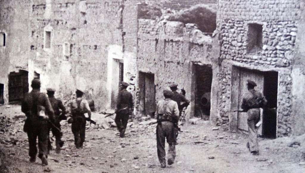 Republican soldiers enter the deserted ruined town of Lleida (Lerida) a key defense point for Barcelona during the Spanish Civil War.