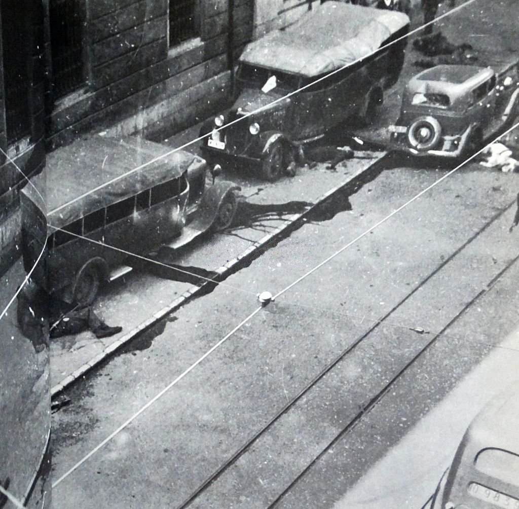 Casualties and injured lie on the streets during the Siege of Gijón.