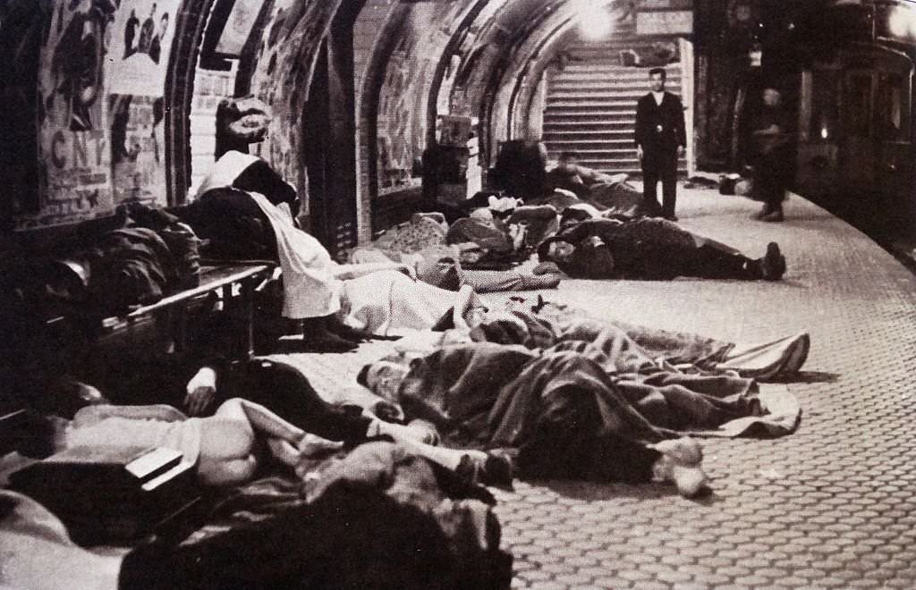 During the Spanish Civil War, civilians take shelter by sleeping on the platforms of the underground metro system.