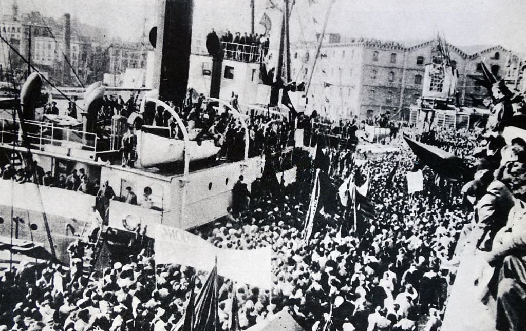 At Cartagena naval base, Spain, republican crowds gather at the arrival of a Soviet Cargo Ship, bringing supplies during the Spanish civil war.