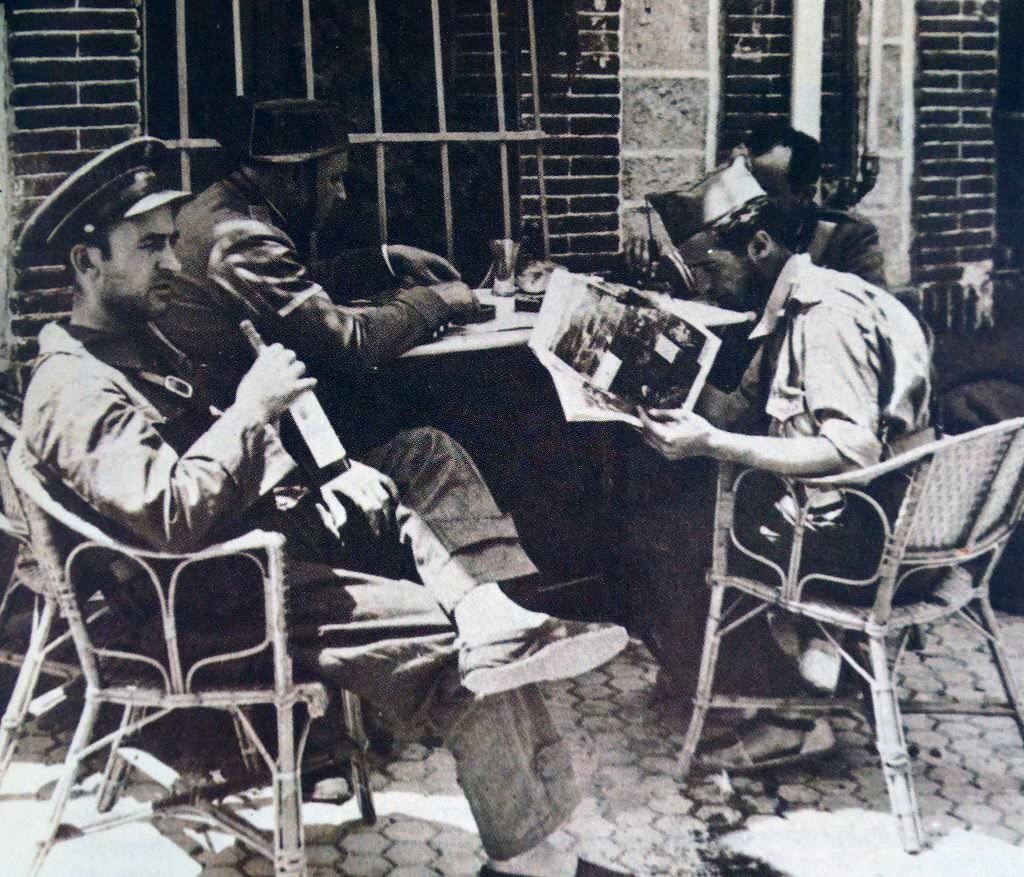 Nationalist troops rest at a café in Guadarrama during the Spanish civil war 1936.