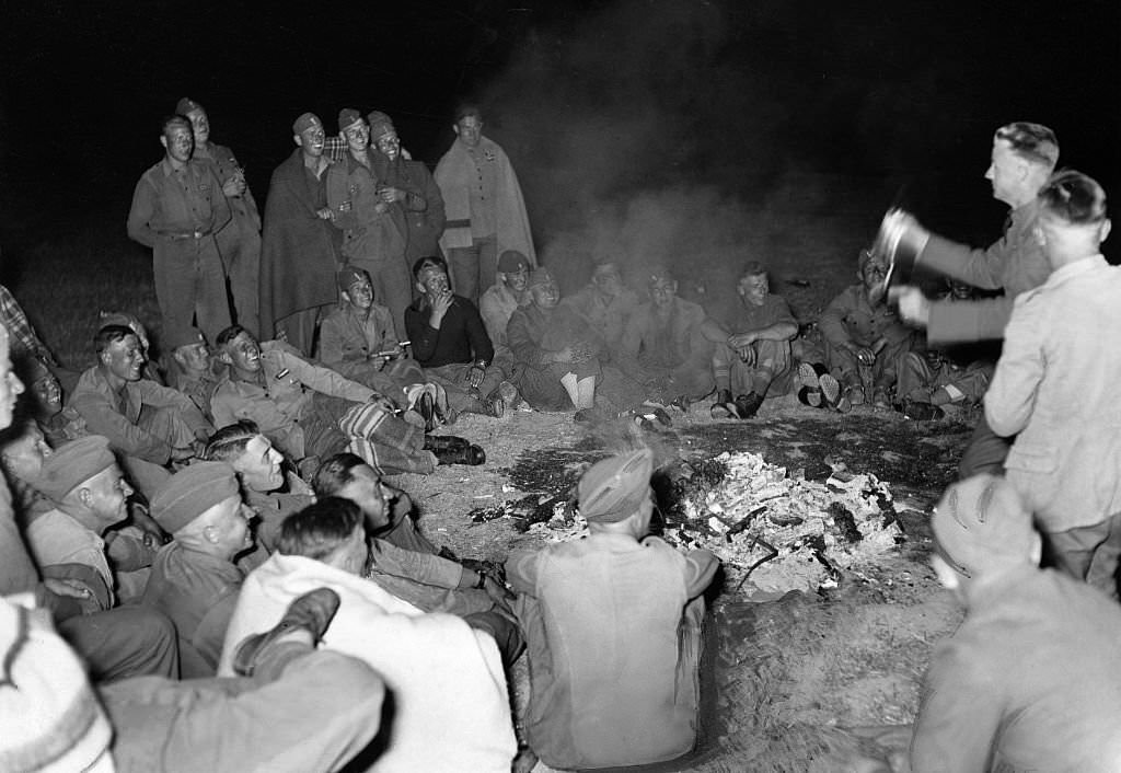 German soldiers of Condor Legion with spanish allies celebrating their victory at a bonfire in Leon, 1939