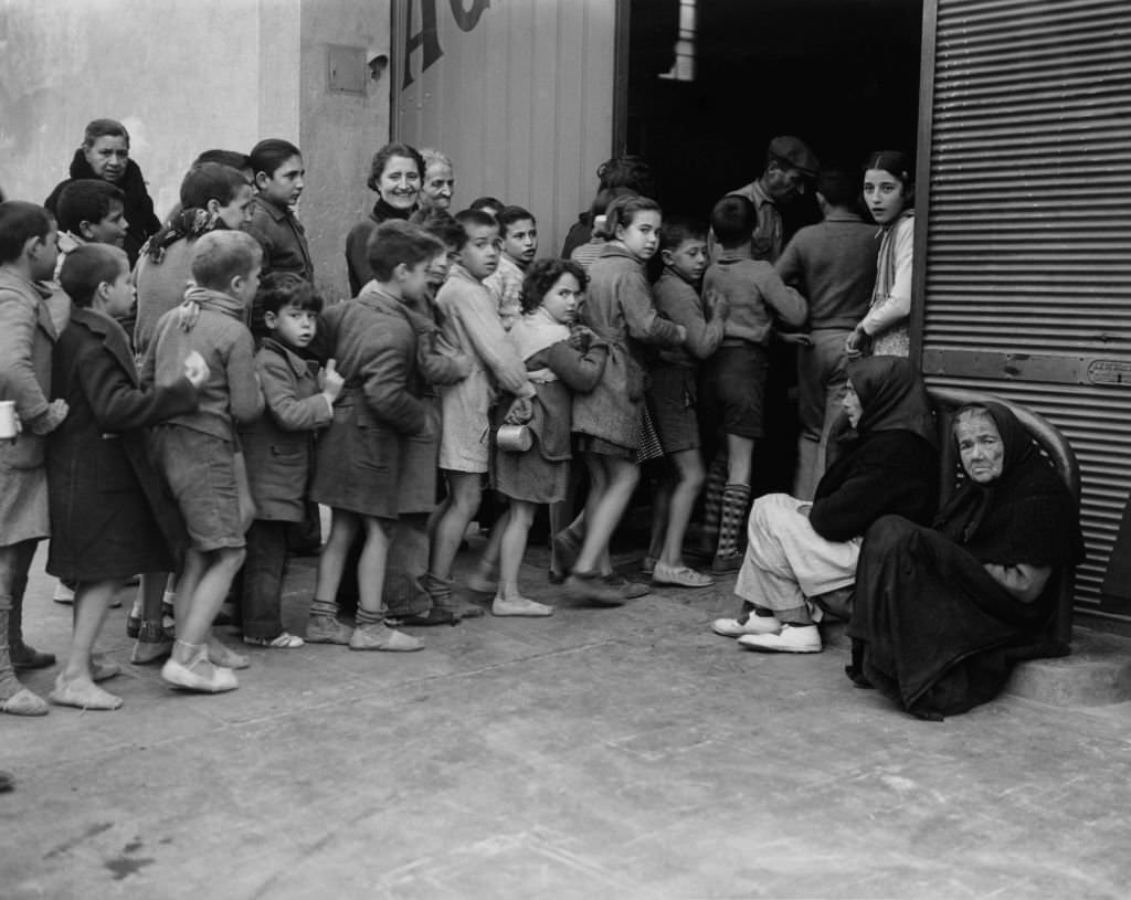 Children queuing for milk rations, Spanish Civil War, December 1937