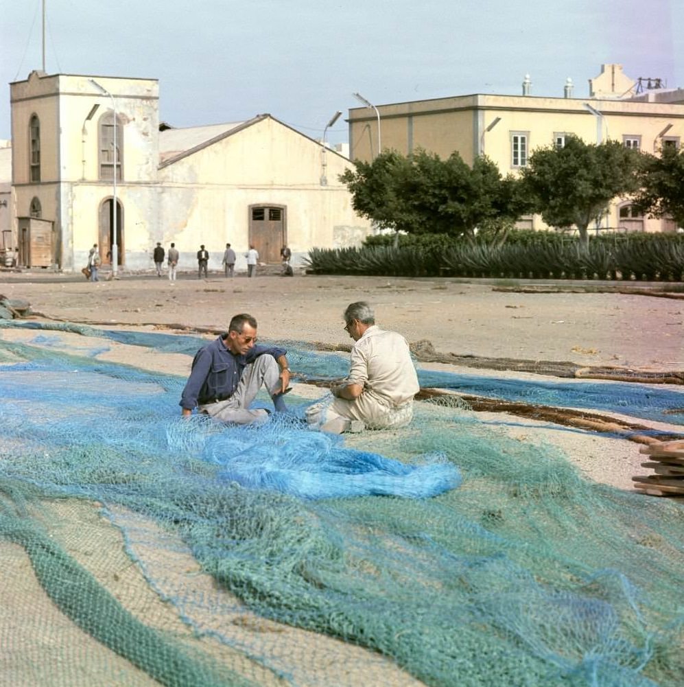 Fishermen repairing nets, Tenerife, 1970