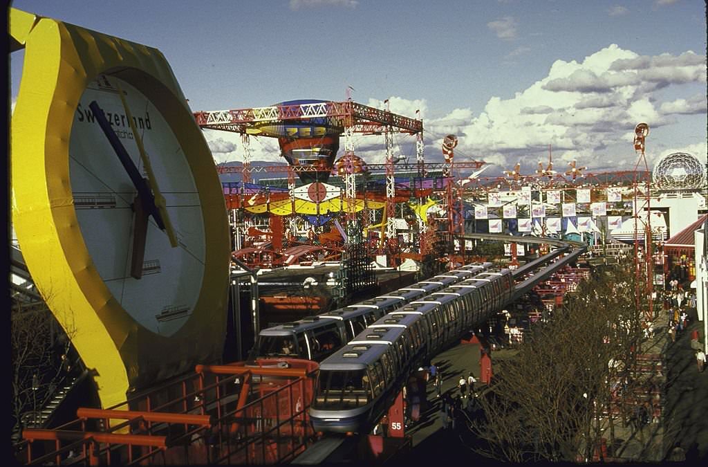 Monorail swooping past Swiss exhibit at Expo 1986 World Fair.