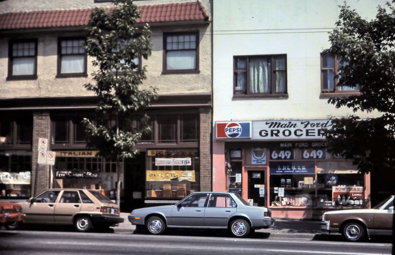 Italian grocery and Main Ford Grocery store on Main Street (just south of Keefer Street), Vancouver, 1984