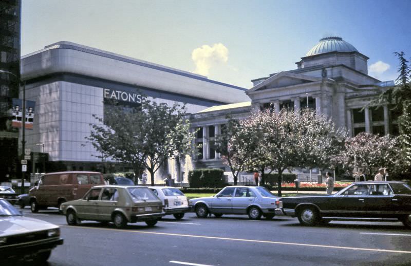 The white wall of Eaton's Department Store is seen behind the Vancouver Art Gallery / Courthouse Plaza from West Georgia Street.