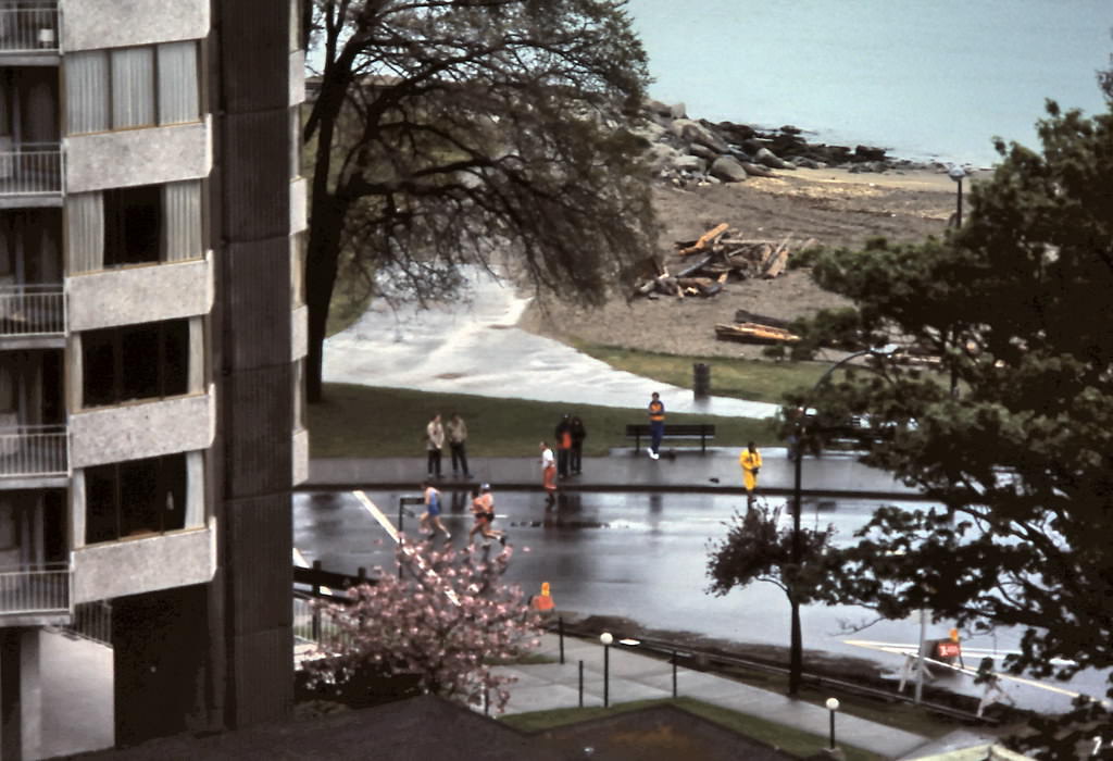 Vancouver marathon on Beach Avenue and the south end of English Bay Beach are seen in this view from a Burnaby Street apartment, Vancouver, 1982.