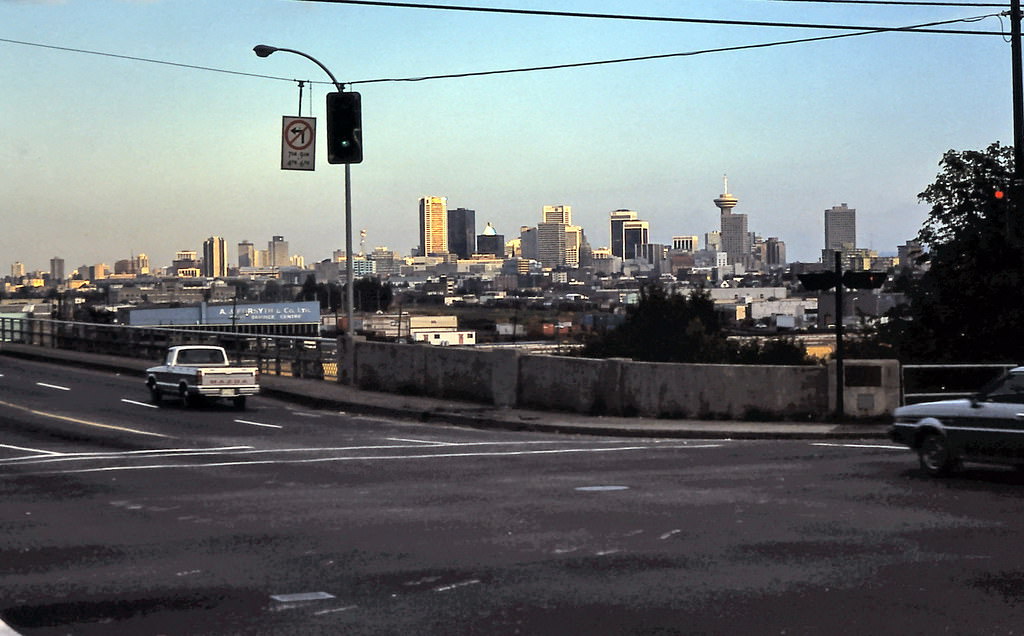 Downtown Vancouver as seen in the morning from First Avenue looking across Clark Drive and Grandview Viaduct in East Vancouver, 1982