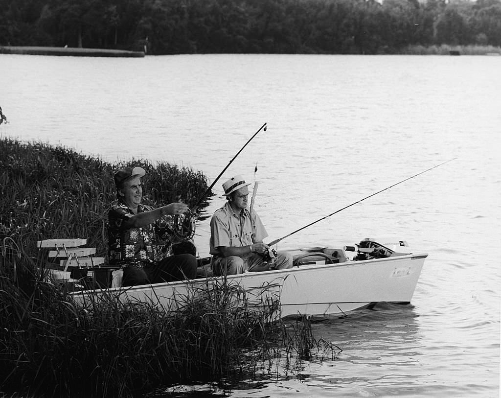 American television host Ed McMahon fishes with actor and comedian Bob Newhart from a rowboat in Cypress Gardens, Florida, 1972.