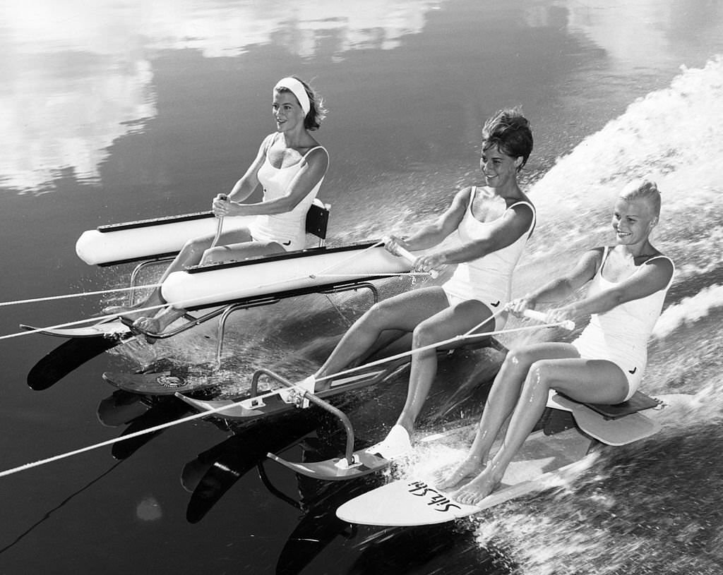 Two new catamaran dual-ski vehicles and a single surfboard called a 'Sitz-Ski' making their debut at Cypress Gardens in Florida, 1967